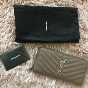 YSL Monogram Zip Around Quilted Leather Wallet.